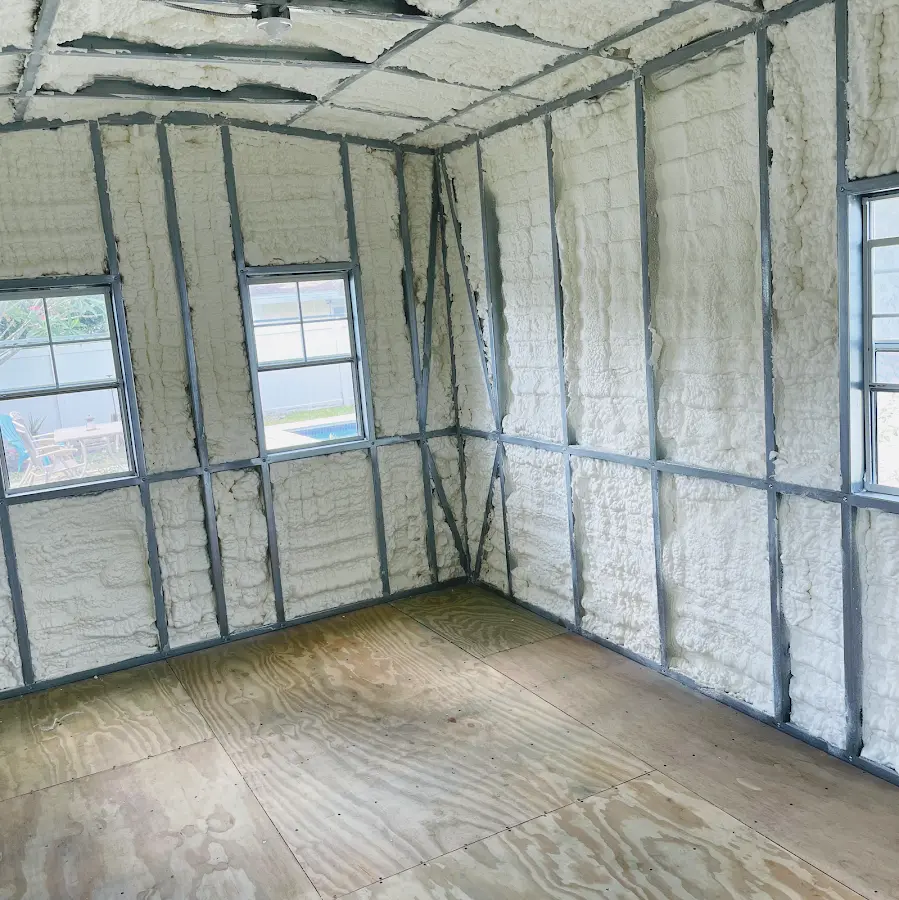 Closed-cell spray foam insulation applied to wall cavities in a residential project in Potsdam
