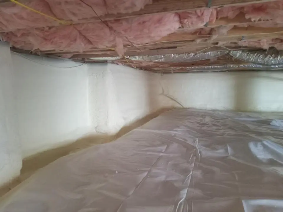 Crawl space encapsulation with closed-cell spray foam for Storm Damage Roof Repair in Potsdam